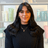 Jessica, professional hair stylist at The Pamper Suite in Bexley, smiling in front of Aveda product display.