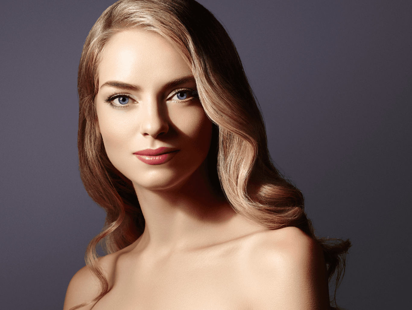 Woman with soft, golden woven highlights concentrated through the parting, styled in polished waves — showcasing a subtle refresh at The Pamper Suite in Bexley.